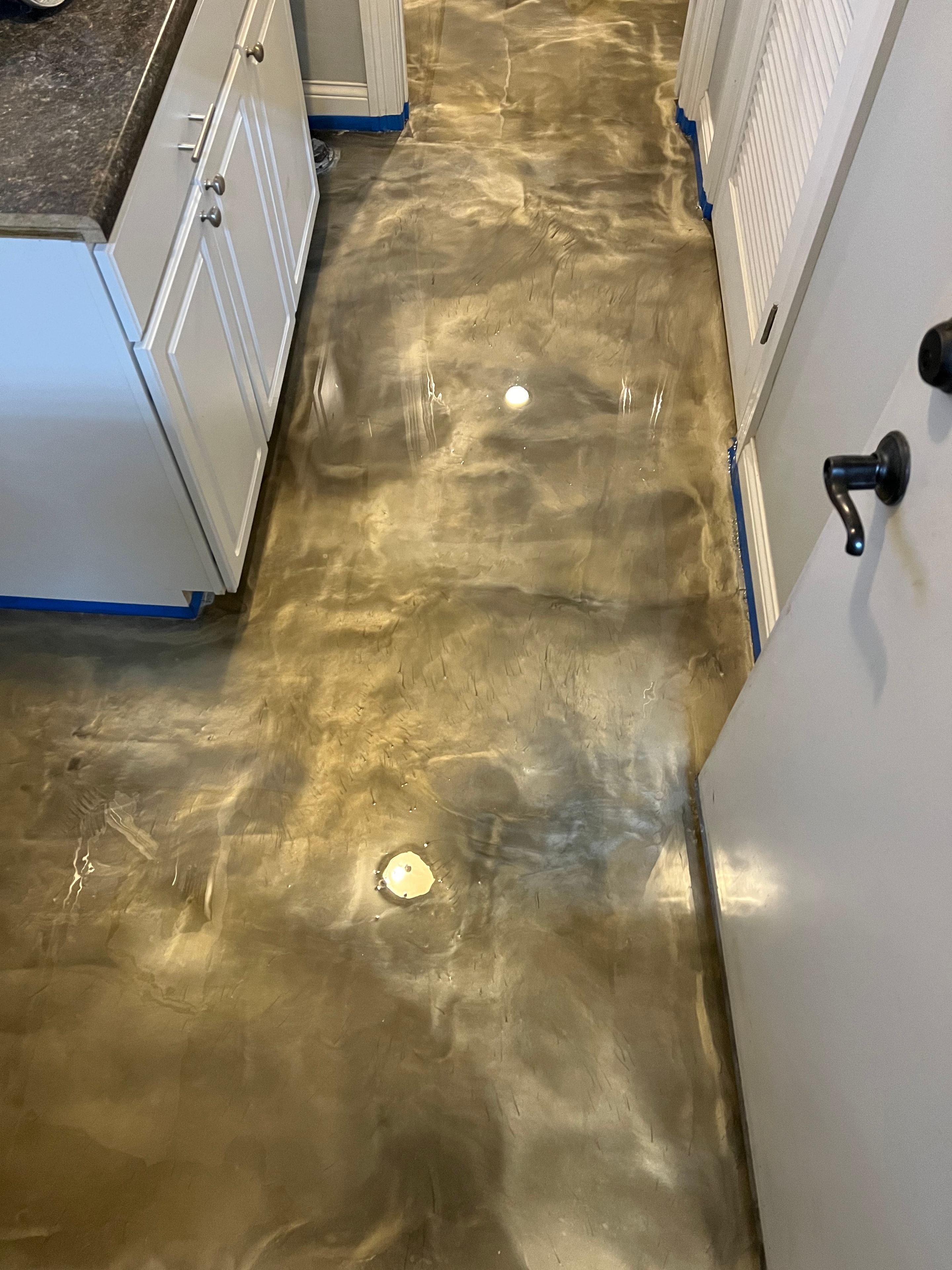 Gold metallic epoxy floor by Expert Concrete Care